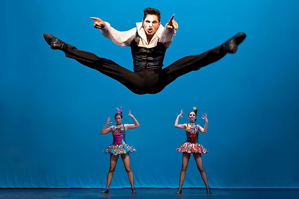 Dancer leaping on stage